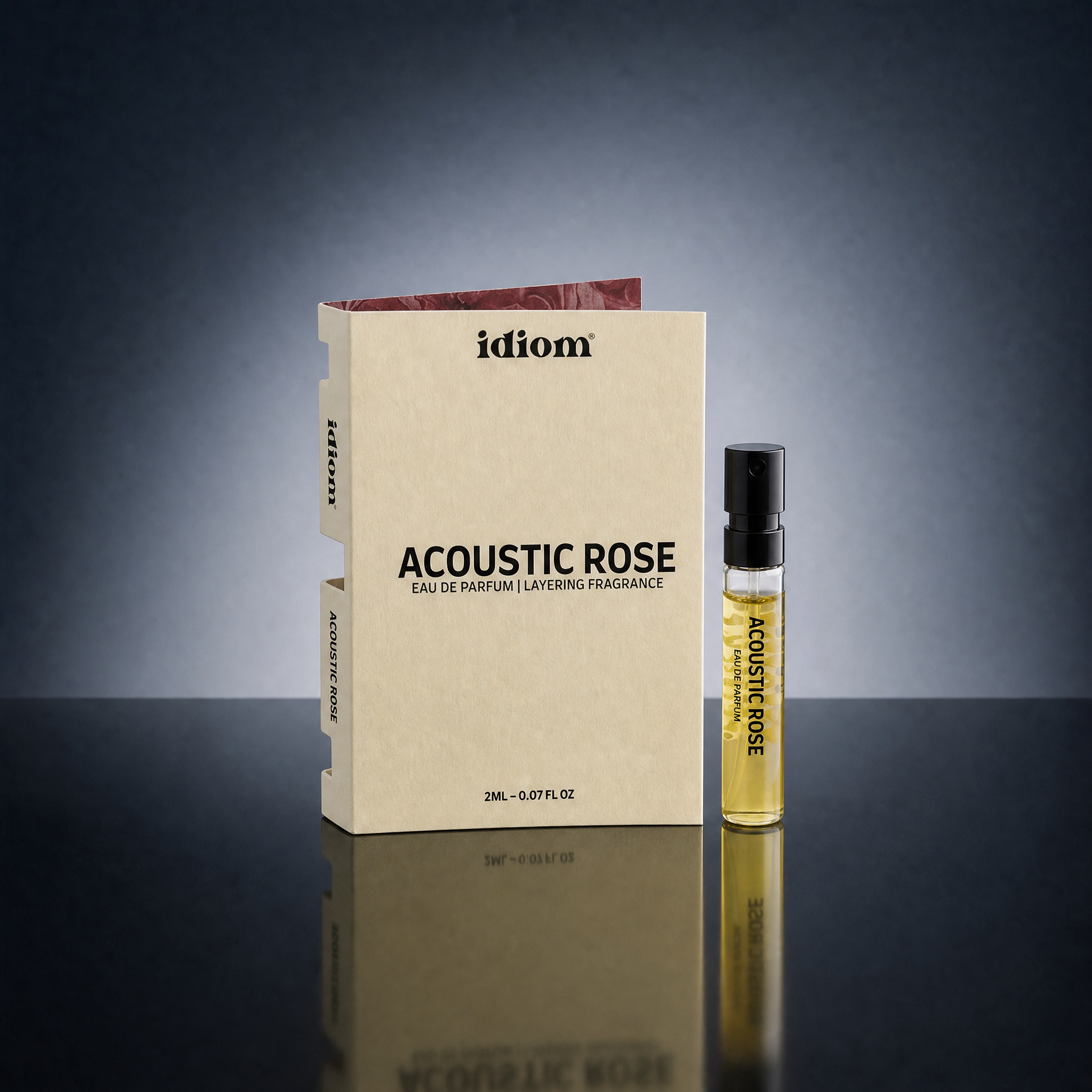 Generated_with_Kive.ai_-_Replace_the_current_product_in_the_scene_with_the_product_from_the_reference_images_a_slim_perfume_sample_vial_with_black_sprayer_and_a_matching_flat_carton_b.png